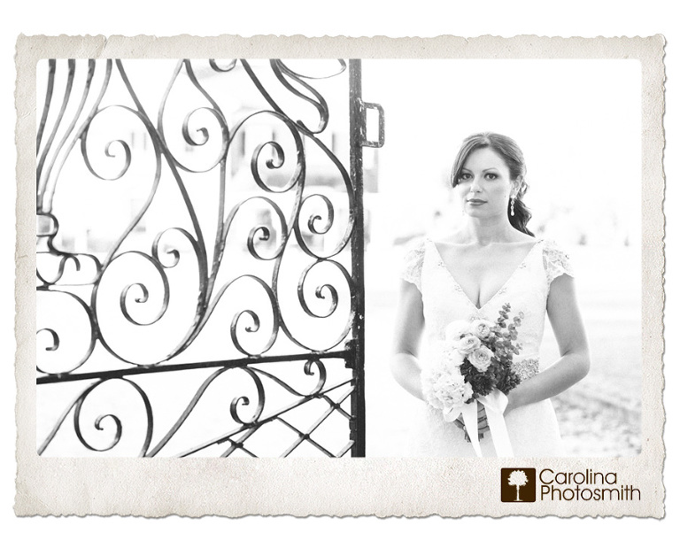 Elegant and statuesque by a Charleston wrought iron plantation gate. Bridal portrait by Carolina Photosmith.