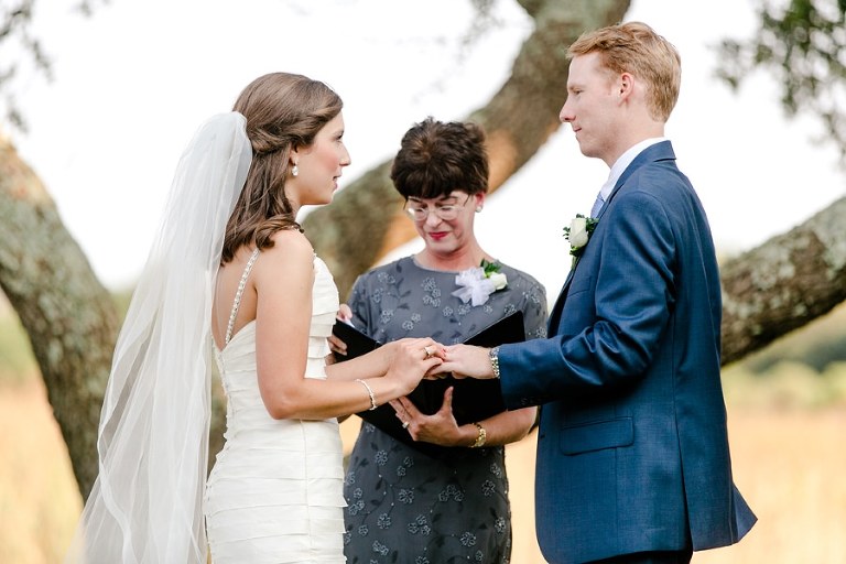 Elegant, outdoor ceremony beside marsh and beach at DeBordieu Colony wedding.