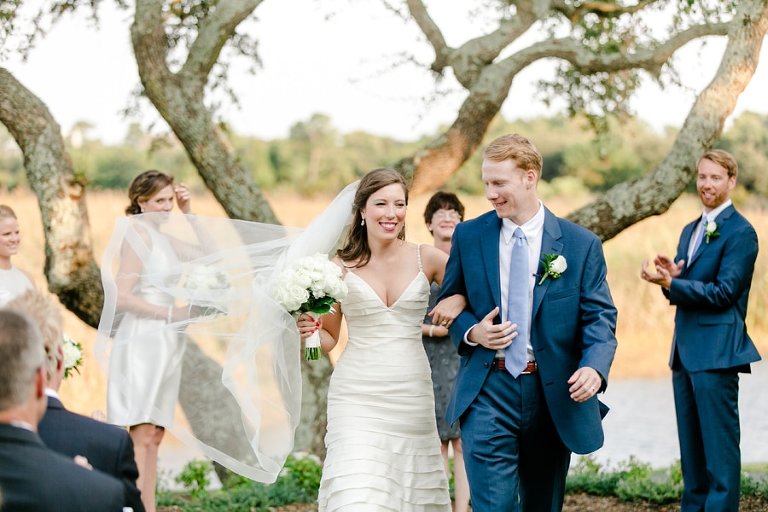 Elegant outdoor wedding ceremony beside the marsh at DeBordieu i