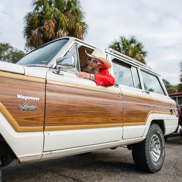 Charleston Beer Can Professor poses with his awesome beard and a 1982 Jeep Wagoneer