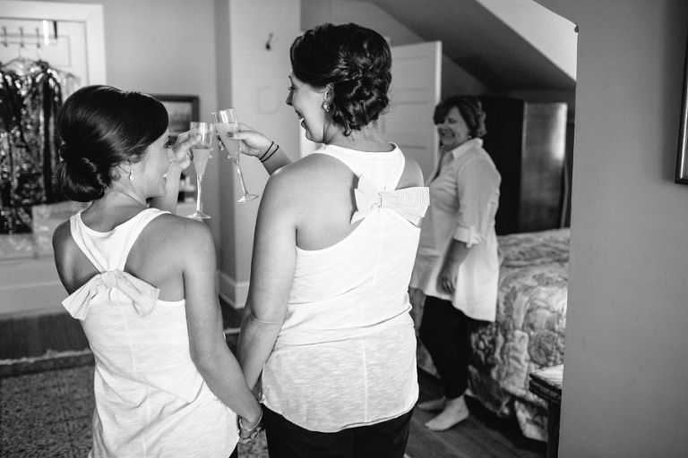 Bride toasts her sister mom looks on River house Charleston