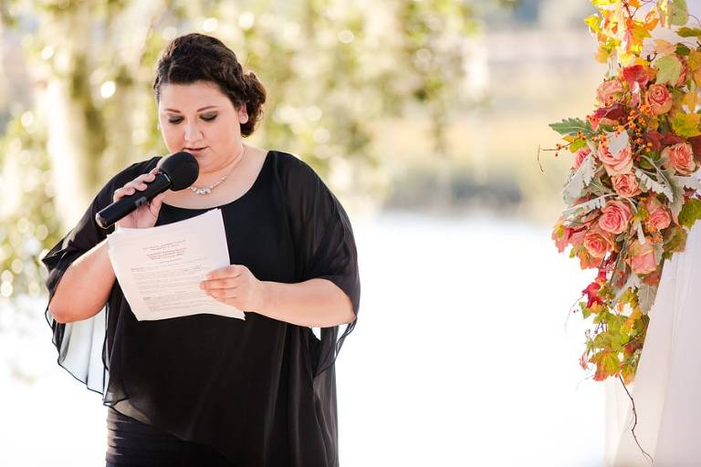 Speaker at Dunes West waterfront wedding on perfect fall day