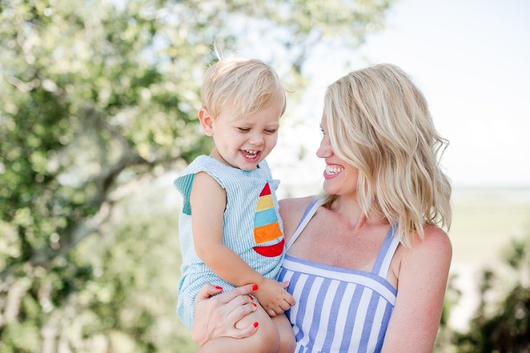 Laughing in mama's arms on the Goat Island rooftop deck