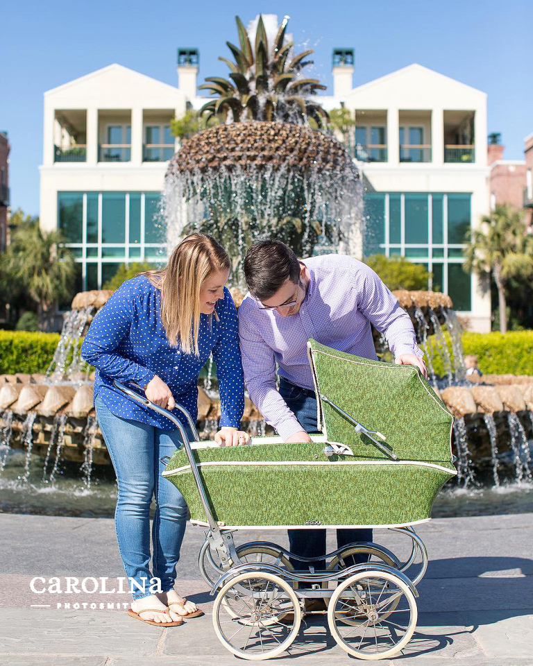 New parents with vintage pram at Charleston's pineapple fountain