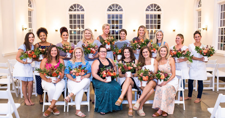 Attendees at Charleston Flower Social show off their fall floral creations. © Carolina Photosmith